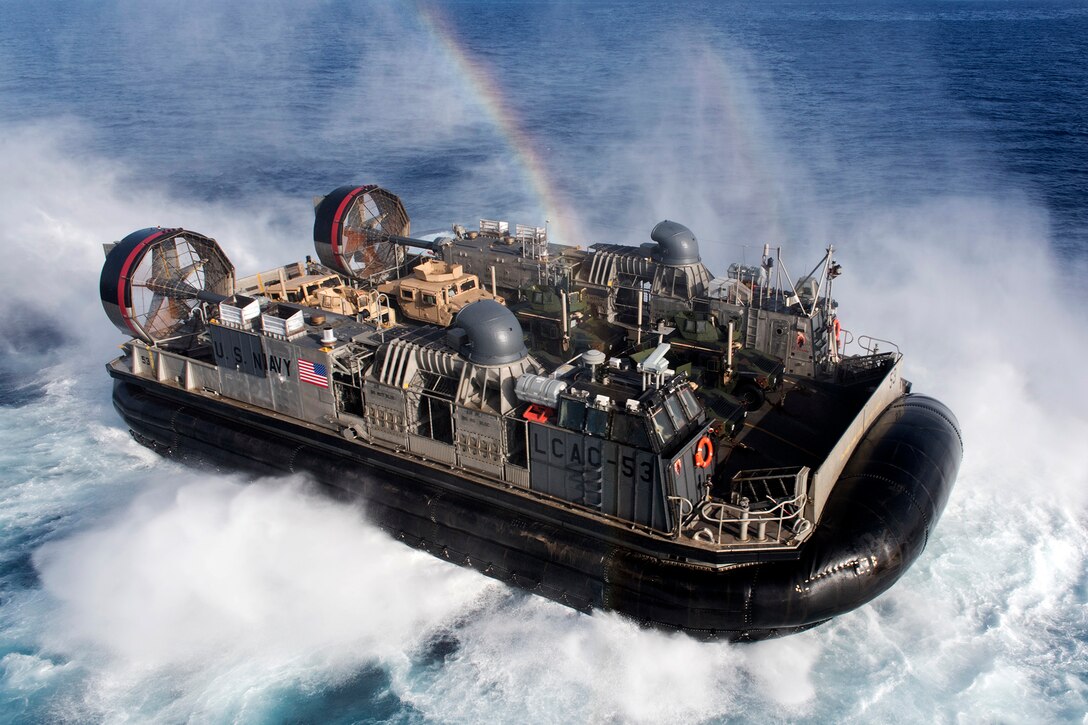 An air-cushion landing craft transits near the amphibious assault ship USS Wasp in the Mediterranean Sea, Sept. 17, 2016. The Wasp is supporting maritime security operations and theater security cooperation efforts in the U.S. 6th Fleet area of operations. Navy photo by Petty Officer 3rd Class Rawad Madanat