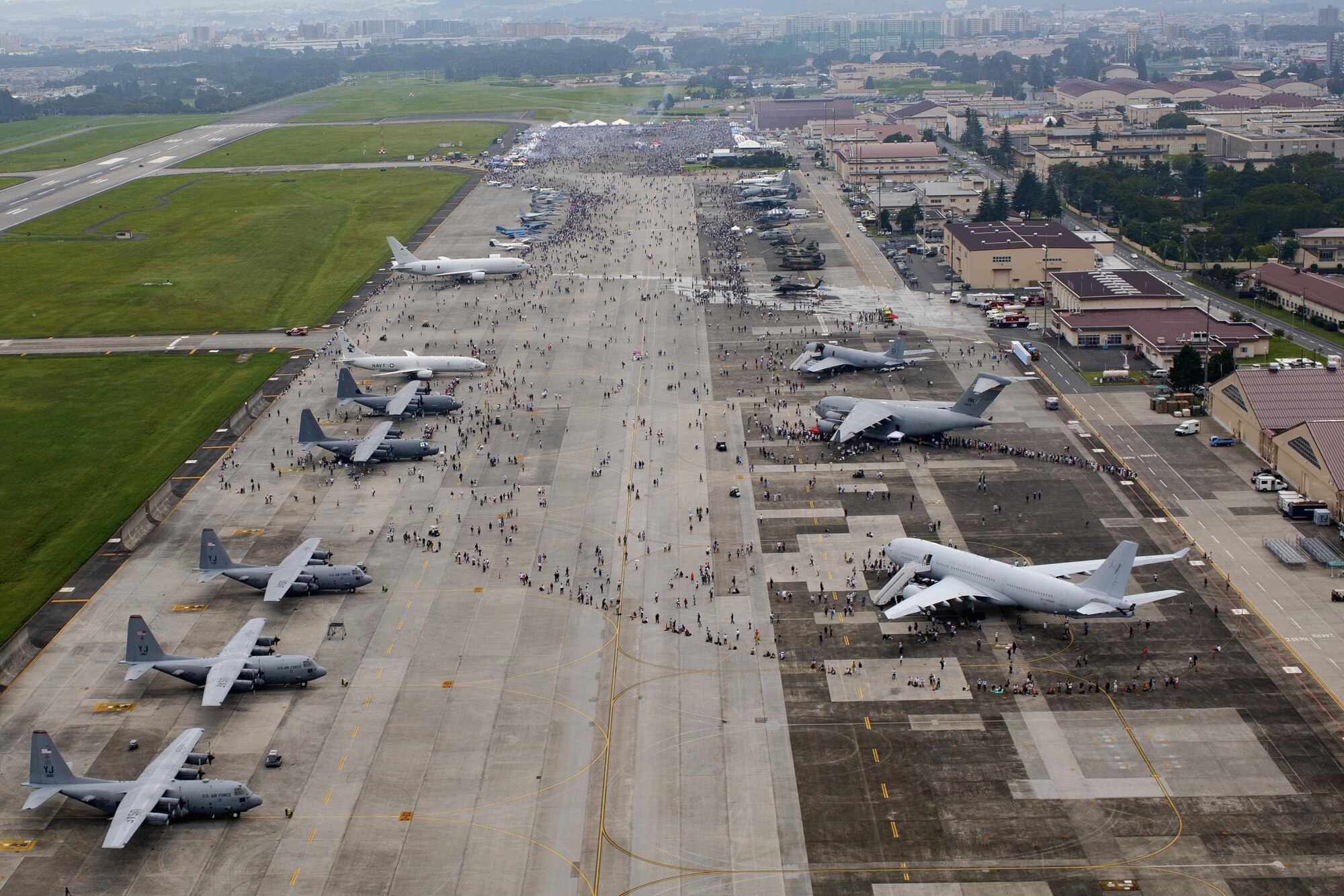 Tens of thousands of visitors crowd the fligtline during the 2016 Japanese-American Friendship Festival at Yokota Air Base, Japan, Sept. 17, 2016. Yokota welcomed over 135,000 visitors to the festival. (U.S. Air Force photo by Yasuo Osakabe/Released)  