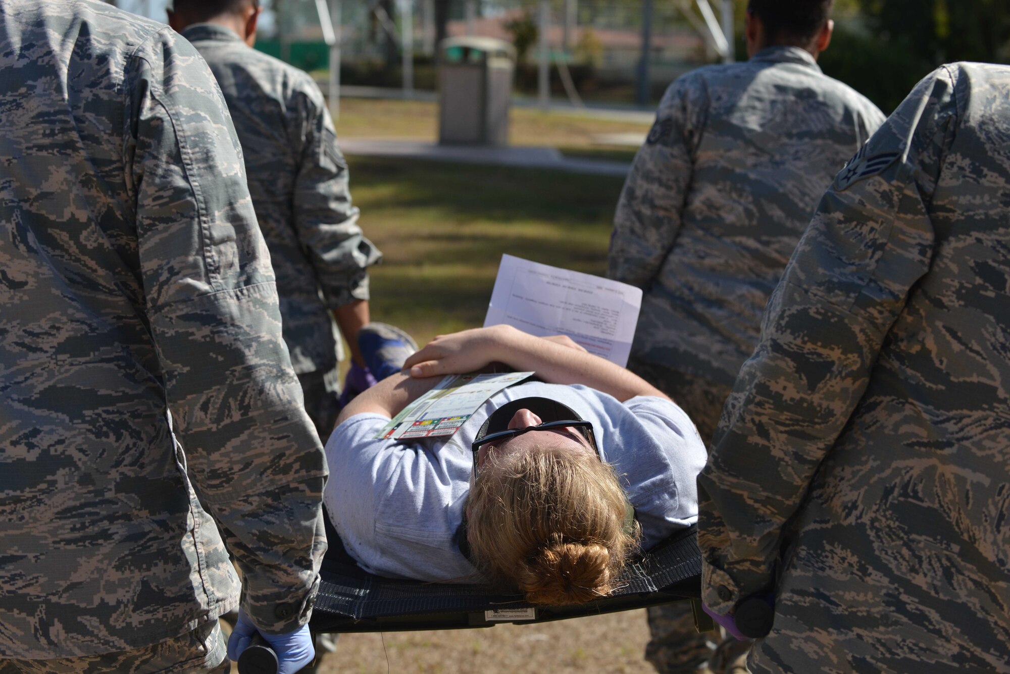 U.S. Airmen from the 39th Medical Group, carry a simulated victim on a litter during a mass casualty exercise Sept. 21, 2016, at Incirlik Air Base, Turkey. Airmen performed safe evacuations of simulated casualties using proper equipment and techniques. (U.S. Air Force photo by Senior Airman John Nieves Camacho)