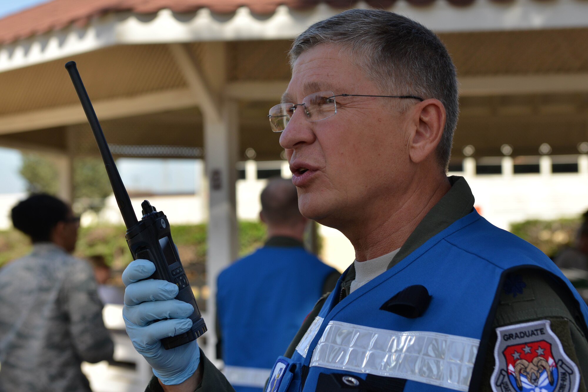 U.S. Air Force Lt. Col. Paul Puchta, 39th Medical Group chief of aerospace medicine, communicates over a land mobile radio (LMR) during a mass casualty exercise Sept. 21, 2016, at Incirlik Air Base, Turkey. LMRs allow quick responses for personnel in the field to communicate when separated. (U.S. Air Force photo by Senior Airman John Nieves Camacho)