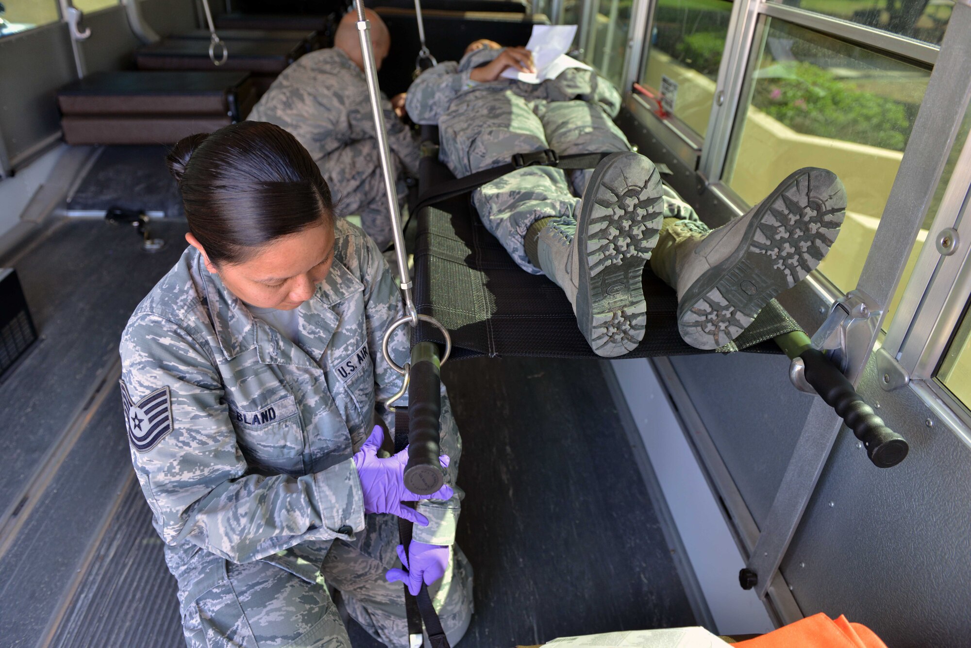 U.S. Air Force Tech. Sgt. Marinelle Bland, 39th Medical Operations Squadron medical admin, secures a simulated victim in a transportation vehicle during a mass casualty exercise Sept. 21, 2016, at Incirlik Air Base, Turkey. Airmen from the 39th Medical Group were tasked with responding to mass casualty scenarios and treating simulated injured personnel. (U.S. Air Force photo by Senior Airman John Nieves Camacho)
