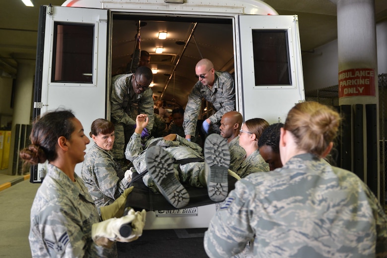 U.S. Airmen from the 39th Medical Group, receive a simulated victim from a transportation vehicle during a mass casualty exercise Sept. 21, 2016, at Incirlik Air Base, Turkey. In addition to their response, Airmen were tested on teamwork and leadership during the exercise. (U.S. Air Force photo by Senior Airman John Nieves Camacho)
