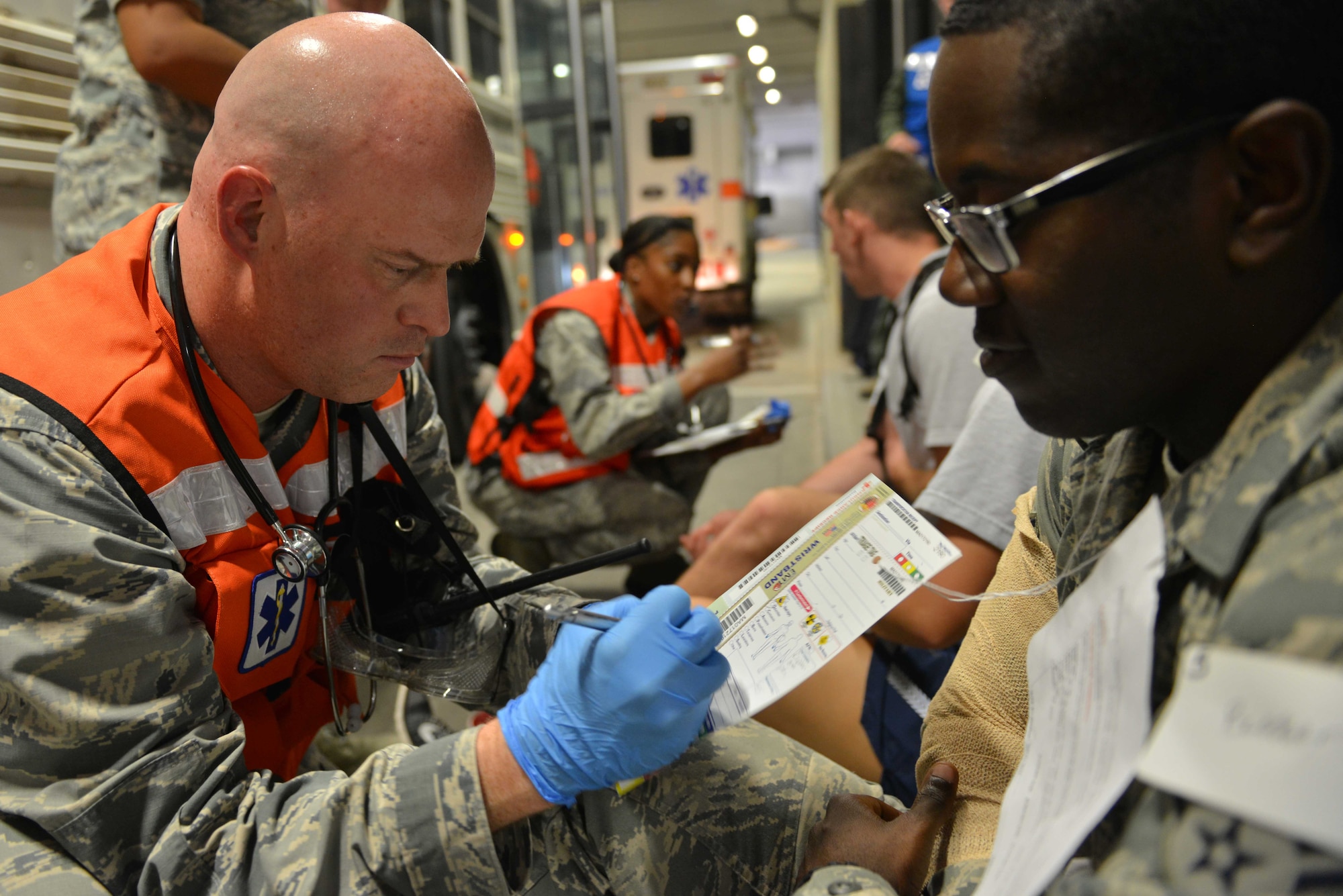 U.S. Air Force Capt. Benjamin Garman, 39th Medical Operations Squadron clinical nurse, annotates a simulated victim’s conditions on a triage tag during a mass casualty exercise Sept. 21, 2016, at Incirlik Air Base, Turkey. Triage tags are used to identify conditions of injured individuals for medical personnel. (U.S. Air Force photo by Senior Airman John Nieves Camacho)