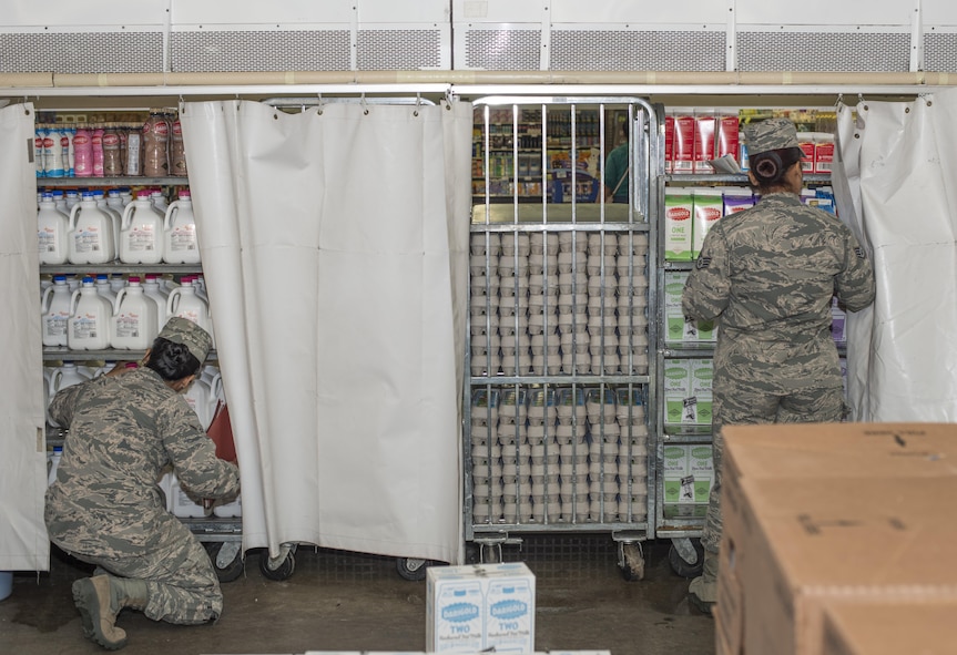 U.S. Air Force Airman Klarizza Yu, a public health technician, left, and Staff Sgt. Amabely Carrillo, the public health NCO in charge, both with the 35th Aerospace Medicine Squadron, check expiration dates on food packaging at Misawa Air Base, Japan, Sept. 20, 2016. Every week public health technicians perform food inspections as part of their food safety and defense programs. (U.S. Air Force photo by Senior Airman Brittany A. Chase)