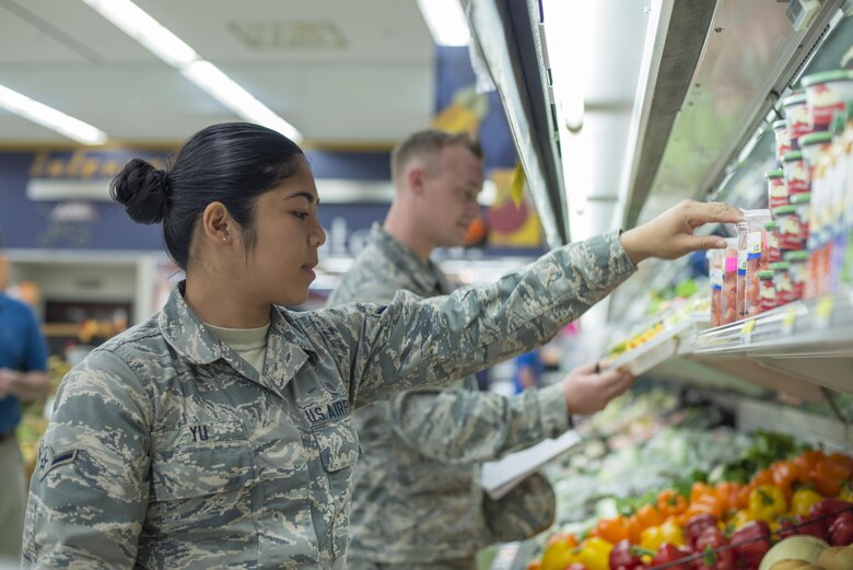 U.S. Air Force Airman Klarizza Yu and Senior Airman Zachary Duncan, both public health technicians with the 35th Aerospace Medicine Squadron, inspect the commissary produce section at Misawa Air Base, Japan, Sept. 20, 2016. Public health specialists help to protect base personnel from a vast array of illnesses and diseases by minimizing health risks within the community. (U.S. Air Force photo by Senior Airman Brittany A. Chase)