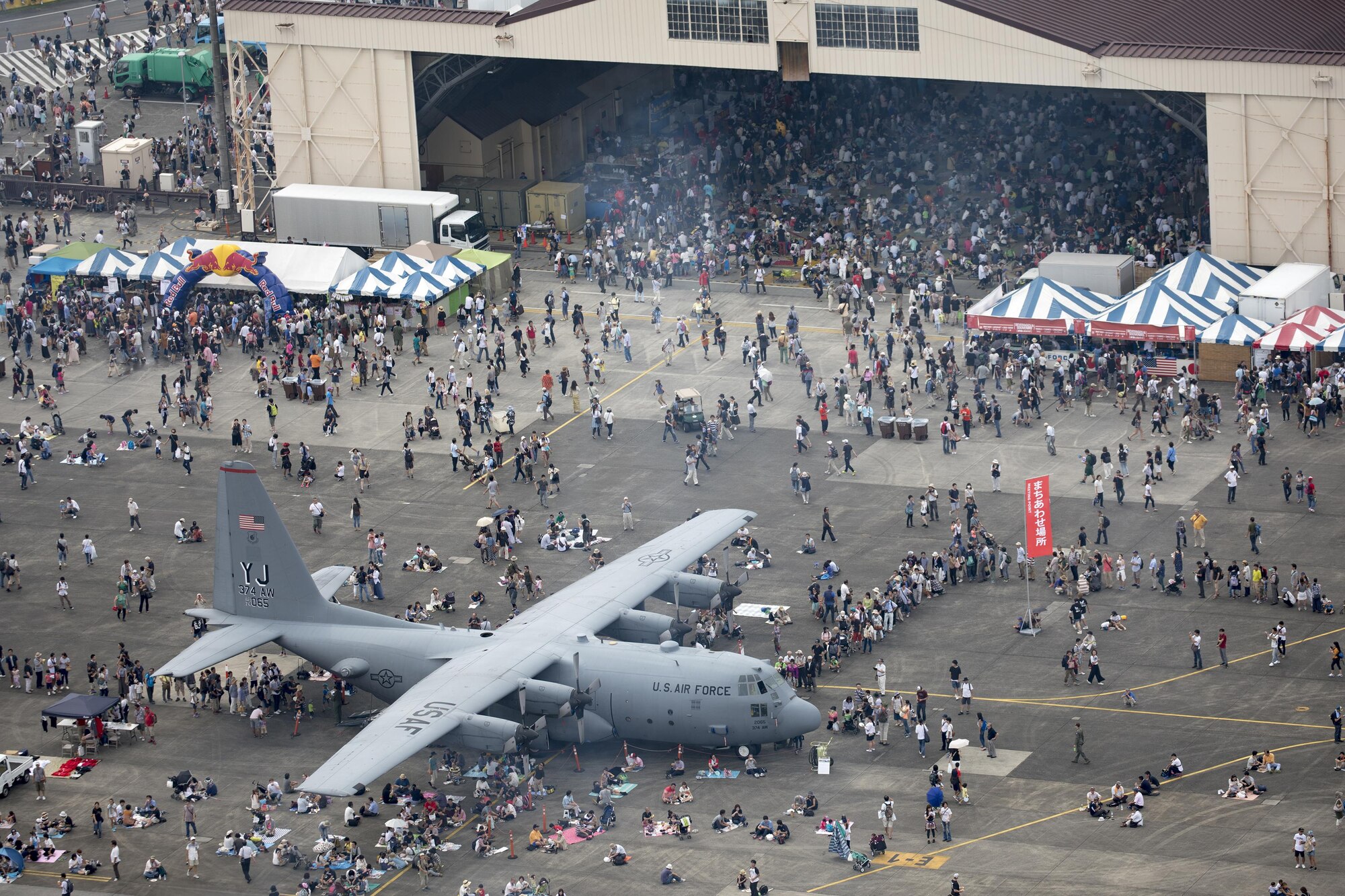 Tens of thousands of visitors crowd the flightline during the 2016 Japanese-American Friendship Festival at Yokota Air Base, Japan, Sept. 17, 2016. Yokota welcomed over 135,000 visitors to the festival. (U.S. Air Force photo by Yasuo Osakabe/Released)  