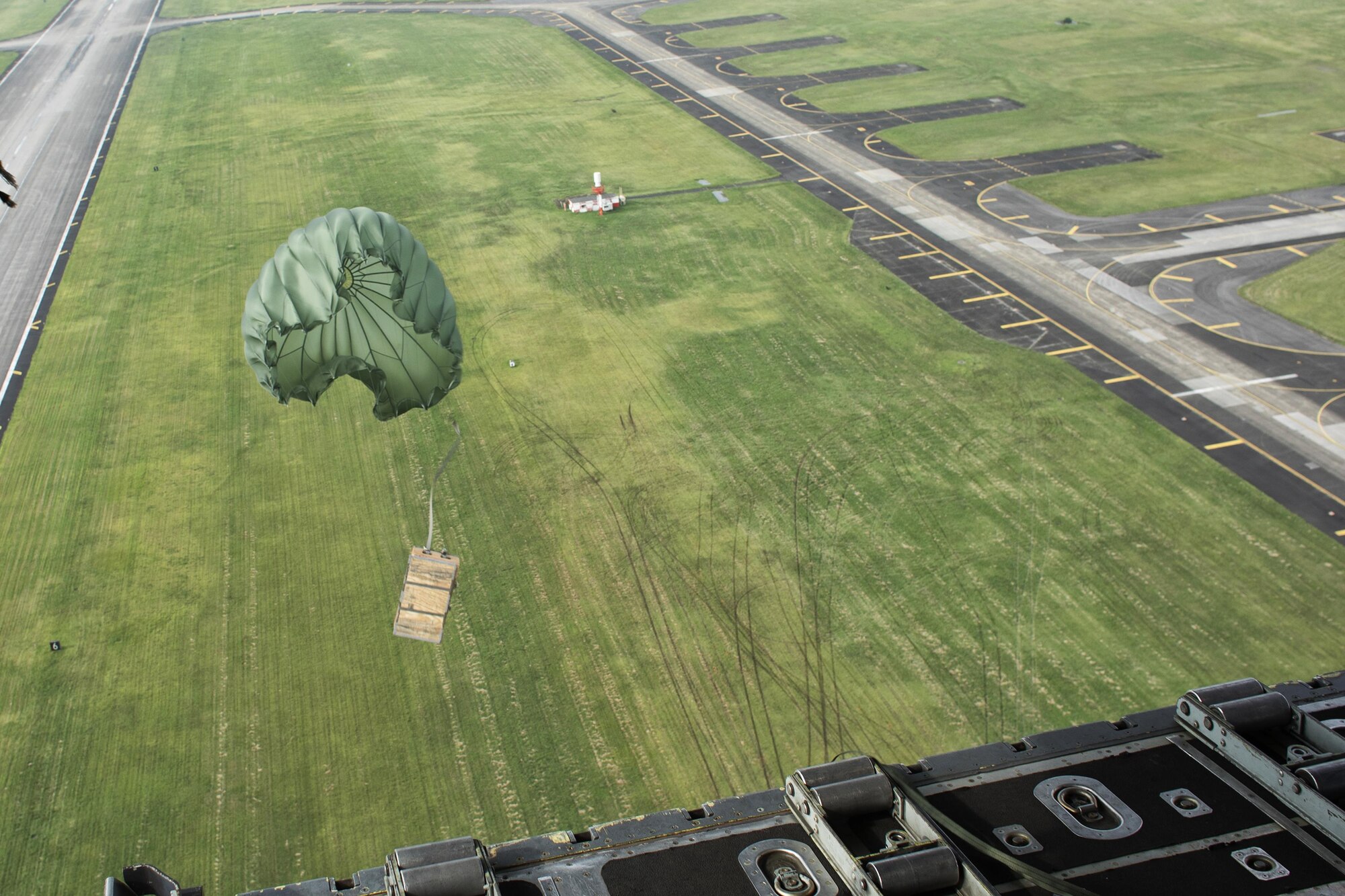A low-cost, low-altitude bundle drops to a drop zone at Yokota Air Base, Japan, Sept. 17, 2016, during the Japanese-American Friendship Festival. The 36 AS demonstrated their airdrop capabilities to festivalgoers. Yokota welcomed over 135,000 visitors to the festival. (U.S. Air Force photo by Yasuo Osakabe/Released)