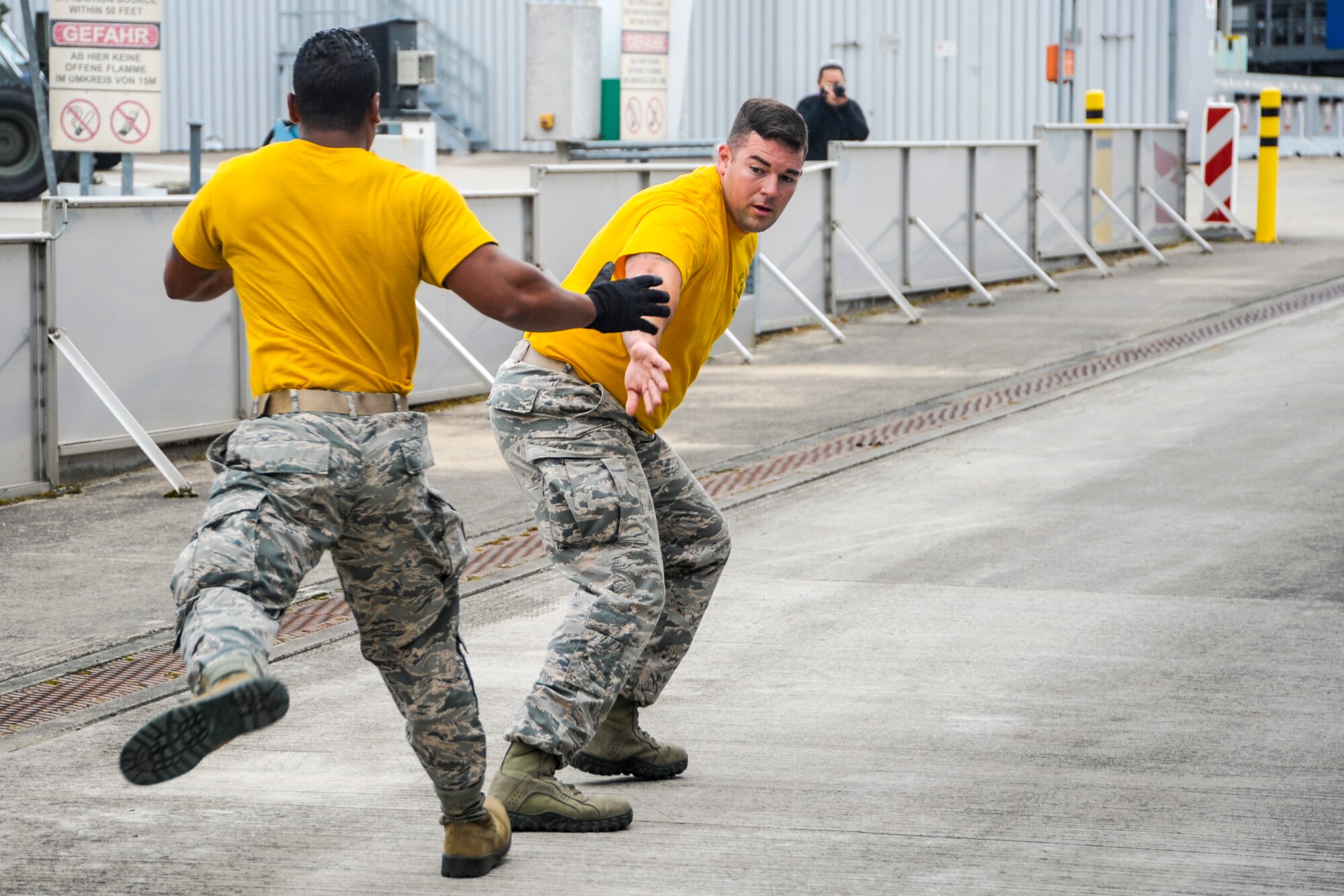 Senior Airman Gregory Foster tags Staff Sgt. Benjamin Patton, both 435th Contingency Response Squadron mobile aerial porters, during the relay run portion of the physical challenge obstacle course Sept. 17, 2016, at Ramstein Air Base, Germany. Forty Airmen representing five units competed in the competition, which was comprised of events that tested the knowledge and skills of air transportation technicians. (U.S. Air Force photo/Staff Sgt. Timothy Moore)