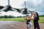 U.S. Army Sgt. 1st Class Amy Brown, and U.S Air Force Senior Airman Leah Ferrante, Defense POW/MIA Accounting Agency (DPAA) photojournalists, take photos of an abandoned Air Force C-130 Hercules while on mission in the Quang Tri Province, Vietnam, Aug. 18, 2016. Members of DPAA traveled to Quang Tri in search of a service member who never returned from a photo reconnaissance mission during the Vietnam War. DPAA’s mission is to provide the fullest possible accounting for our missing personnel to their families and the nation. (DoD courtesy photo)  