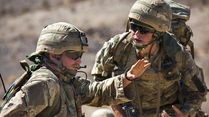 British Royal Marines discuss their scheme of maneuver during an assault on Range 205 as part of Exercise Black Alligator aboard the Marine Corps Air Ground Combat Center, Twentynine Palms, Calif., Sept. 13, 2016. Black Alligator, an annual training exercise, consists of approximately 1,000 British Royal Marines and 170 Dutch Royal Army soldiers who train aboard the installation in excess of 45 days to conduct relevant live-fire combined arms training, urban operations, and joint and coalition-level integration alongside more than 300 U.S. Marines consisting of artillerymen, engineers and tankers.