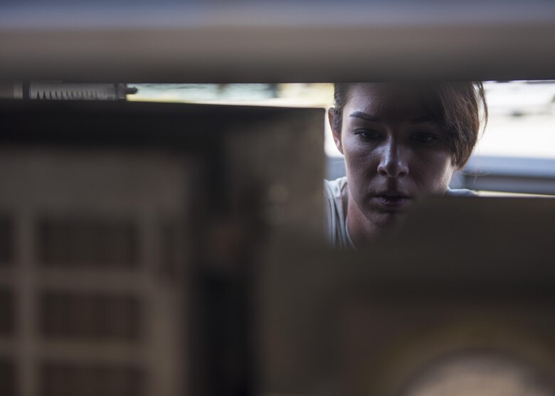 Staff Sgt. Amy Teston, 455th Expeditionary Maintenance Squadron aerospace ground equipment journeyman, rewires a generator, Bagram Airfield, Afghanistan, Sept. 22, 2016. Generators provide electrical power to aircraft. (U.S. Air Force photo by Senior Airman Justyn M. Freeman)