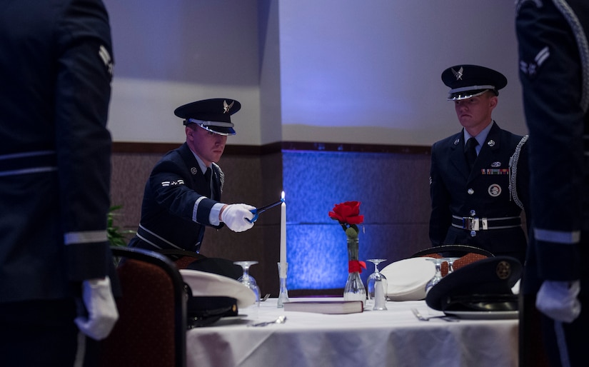 Airmen from the Joint Base Charleston Honor Guard present the POW/MIA table ceremony preceding the 2016 Air Force Ball, Sept. 17, 2016 at the Charleston Convention Center here. The theme for this year’s event was, “Profession of Arms: Forging the American Airman.” The ball celebrated the people and events that shaped the Air Force through its 69-year history. 