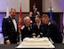 U.S. Air Force retired Lt. Gen. Brooks L. Bash (second from the left), Airman 1st Class Cassandra Macdonald, 628th Medical Group records technician (second from the right) and Lt. Col. Walter Bean, 628th Airbase Wing chaplain (right) cut the cake with a saber during the 2016 Air Force Ball Sept. 17, 2016 at the Charleston Convention Center here. It is tradition for the youngest and oldest Airmen to cut the cake together signifying respect and honor afforded to experience and seniority while symbolizing the newer generation of Airmen filling the ranks.