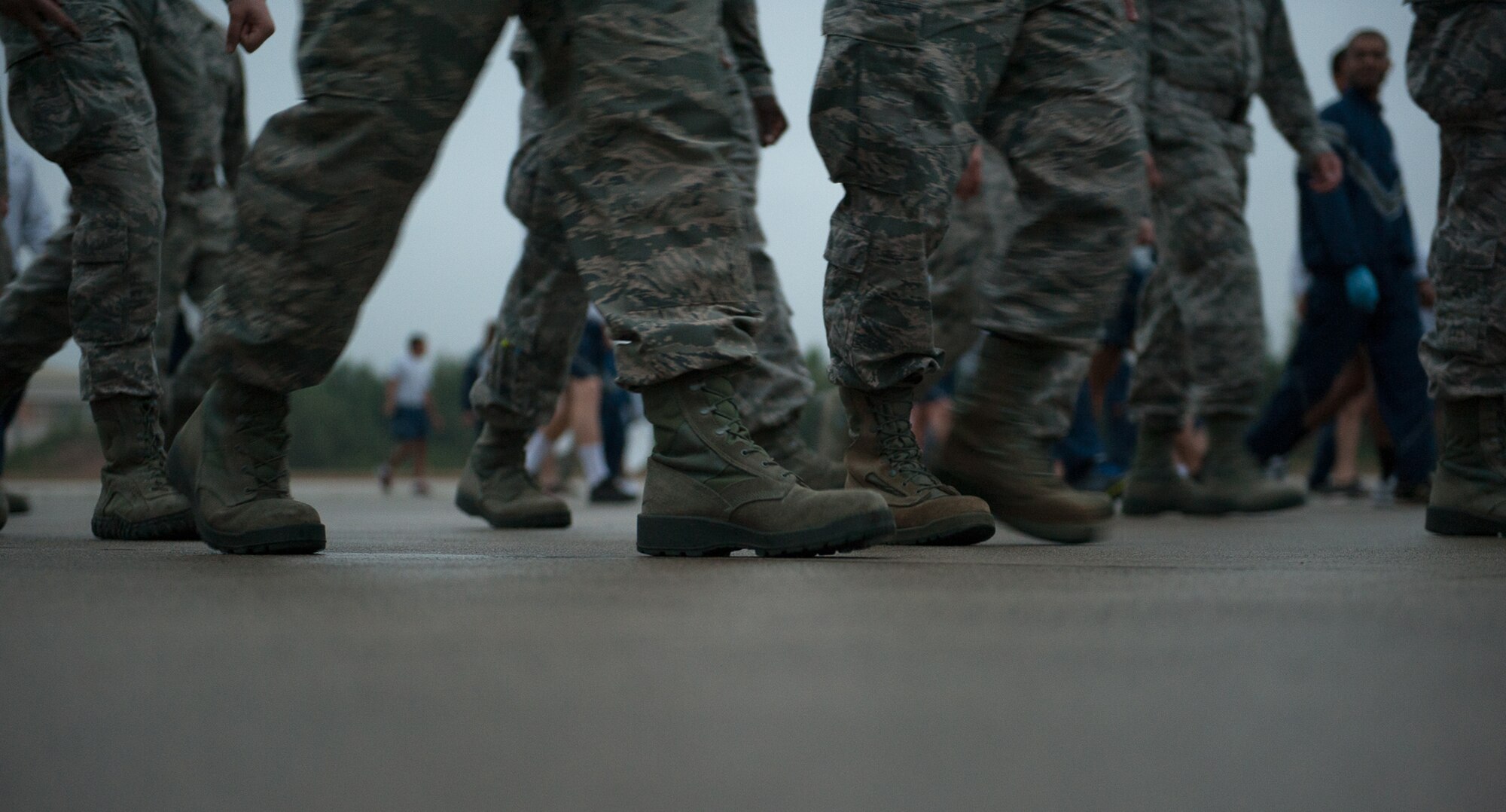 Airmen walk and look for debris during a foreign object damage prevention walk Sept. 20, 2016, at Ramstein Air Base, Germany.  The 86th Airlift Wing FOD Prevention Program helps to ensure the safety of vehicles, personnel, and aircraft here, and is essential to the everyday operations of the flightline. (U.S. Air Force photo/ Airman 1st Class Savannah L. Waters)
