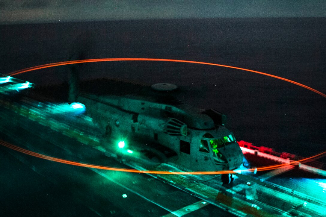 A CH-53E Super Stallion helicopter idles on the flight deck of the USS Bonhomme Richard during low-light takeoff and landing exercises off the coast of the Northern Mariana Islands in the Philippine Sea, Sept. 18, 2016. The helicopter crew is assigned to Marine Medium Tiltrotor Squadron 262 (Reinforced), 31st Marine Expeditionary Unit. The expeditionary unit is embarked aboard the ships of the Bonhomme Richard Expeditionary Strike Group as part of a routine patrol in the Indo-Asia-Pacific region. Marine Corps photo by Staff Sgt. T.T. Parish