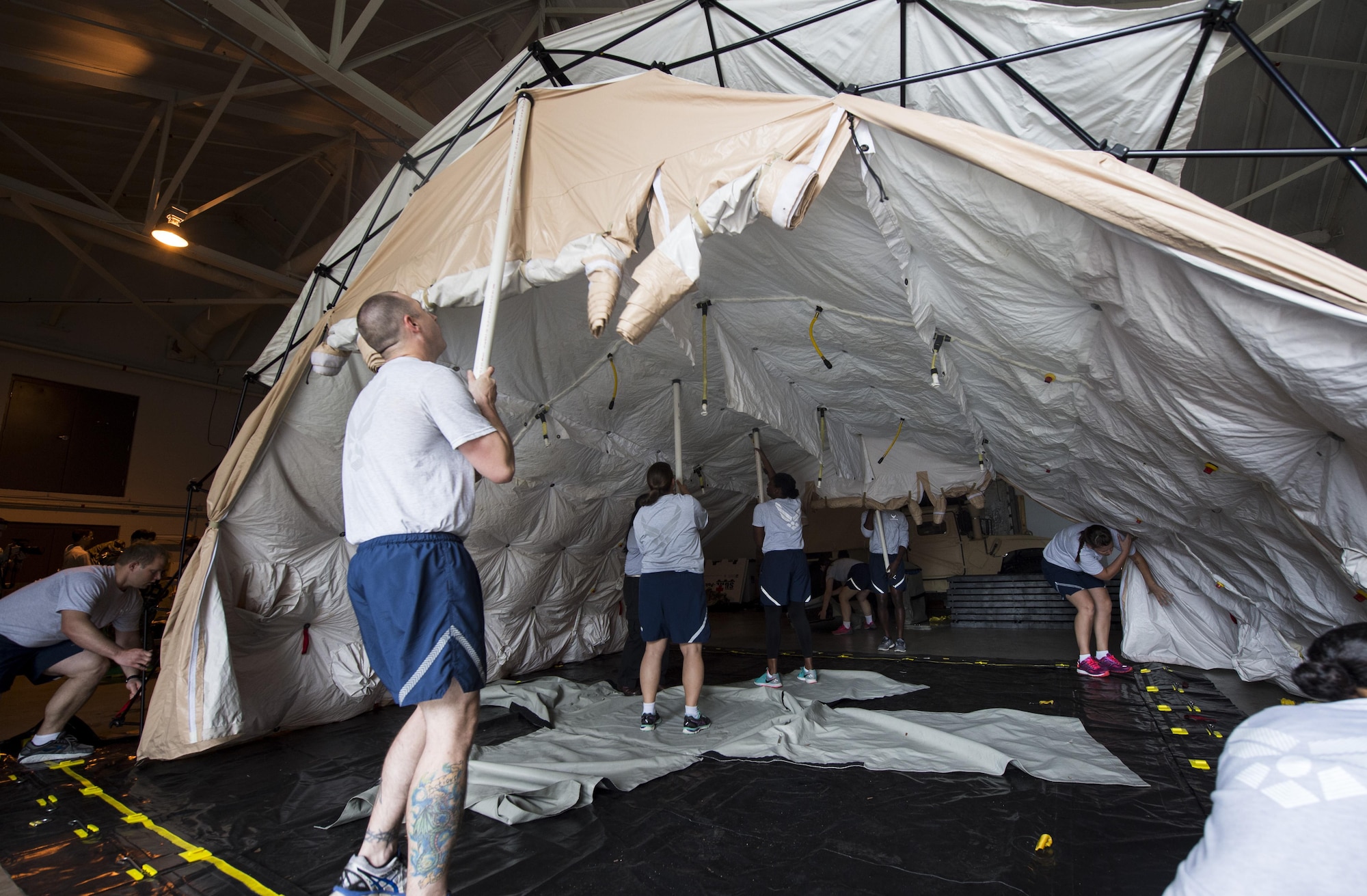 628th Medical Group members set-up a patient decontamination tent as part of a patient decontamination exercise drill here Sept. 15, 2016. Participants were required to ensure the shelter is operational within 15 minutes in preparation to receive and decontaminate patients in the tent. 