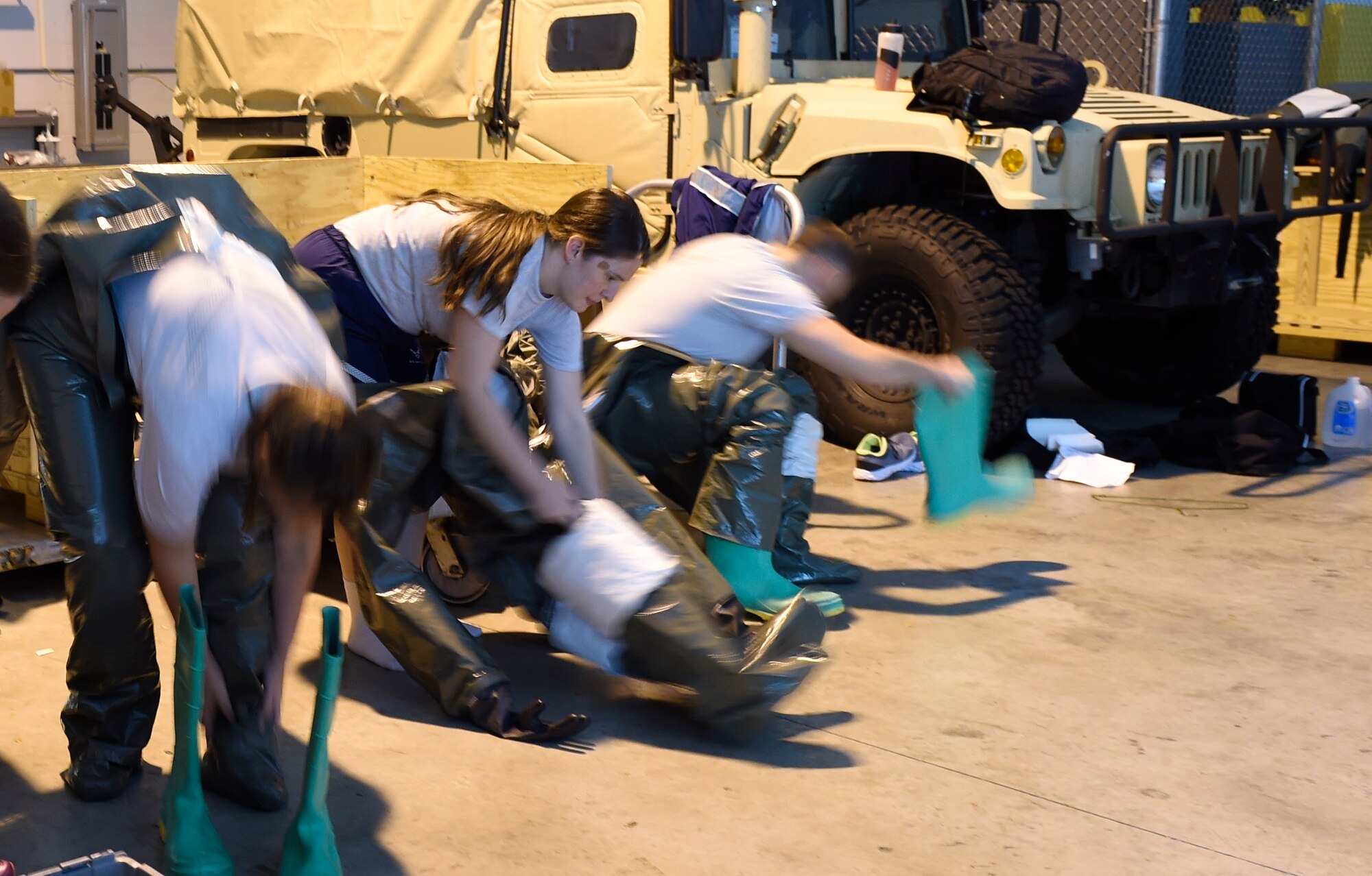 628th Medical Group members don chemical, biological, radiological and nuclear (CBRN) gear during a patient decontamination exercise drill here Sept. 15, 2016. 628th MDG conducted a joint certification course with Decon L.L.C., including an intensive, three day patient decontamination exercise to prepare Air Force medical responders to save lives, provide shelter and protect facilities in times of crisis. 