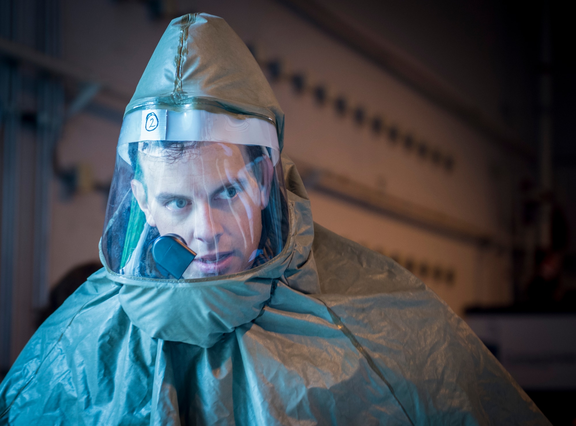 Capt. Matthew Burns, 628th Aerospace Medicine Squadron dental provider observes the patient decontamination tent during a patient decontamination exercise drill here Sept. 15, 2016. 628th MDG conducted a joint certification course with Decon L.L.C., including an intensive, three day patient decontamination exercise to prepare Air Force medical responders to save lives, provide shelter and protect facilities in times of crisis. 