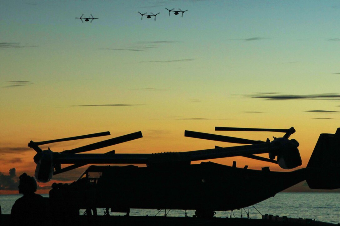 Three MV-22B Osprey tiltrotor aircraft prepare to land aboard the USS Bonhomme Richard during Valiant Shield 16 off the coast of the Northern Mariana Islands in the Philippine Sea, Sept. 20, 2016. Valiant Shield is a biennial Air Force, Navy and Marine Corps exercise focused on sustaining joint forces at sea, in the air, on land and in cyberspace. Marine Corps photo by Cpl. Samantha Villarreal