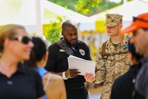 U.S. Marine Sgt. Levi Hodge with the 22nd Marine Expeditionary Unit and a member of the local guard force escort U.S. and international citizens during a bilateral non-combatant evacuation exercise at the U.S. Embassy, Muscat, Oman, Sept. 21, 2016. The non-combatant evacuation exercise is an opportunity for the United States and Oman to practice a bilateral mission of quickly providing security and safety to U.S. and international citizens abroad during a natural disaster or contingency.