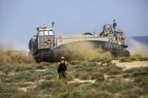 A U.S. Navy Landing Craft Air Cushioned (LCAC) with Assault Craft Unit 4 transports U.S. and international citizens to the amphibious transport dock ship USS San Antonio (LPD 17) during a bilateral non-combatant evacuation exercise at the U.S. Embassy, Muscat, Oman, Sept. 21, 2016. The non-combatant evacuation exercise is an opportunity for the United States and Oman to practice a bilateral mission of quickly providing security and safety to U.S. and international citizens abroad during a natural disaster or contingency.