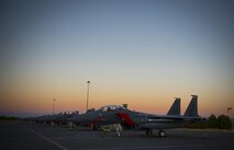 F-15E Strike Eagles assigned to the 494th Fighter Squadron from Royal Air Force Lakenheath, England, sit on the flightline during sunrise before a sortie in support of Tactical Leadership Programme 16-3 at Los Llanos Air Base, Spain Sep. 16. Training programs like the TLP showcase how the U.S. works side-by-side with NATO Allies and partners every day training to meet future security challenges as a unified force. (U.S. Air Force photo/ Staff Sgt. Emerson Nuñez)