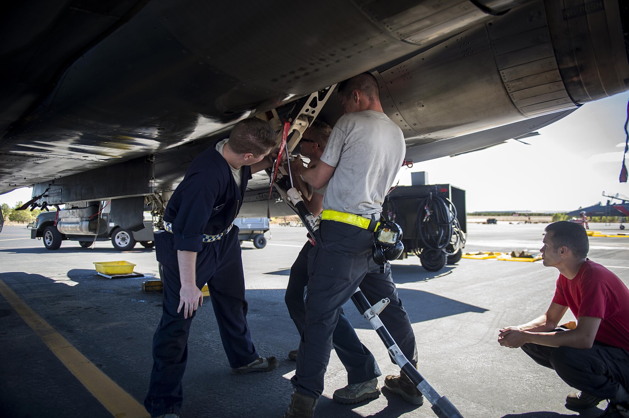 Dedicated crew chiefs from the 48th Aircraft Maintenance Squadron inspect a tail hook on an F-15E Strike Eagle after a sortie in support of Tactical Leadership Programme 16-3 at Los Llanos Air Base, Spain Sep. 16. The training prepares NATO and allied forces’ flight leaders to be mission commanders, lead coalition force air strike packages, instruct allied flying and non-flying personnel in matters related to tactical composite air operations, and provide tactical air expertise to NATO agencies. (U.S. Air Force photo/ Staff Sgt. Emerson Nuñez)