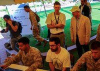 U.S. Ambassador Marc J. Sievers speaks with Consular Chief Sean M. Hanifen as U.S. Marines with the 22nd Marine Expeditionary Unit and Embassy personnel process U.S. and international citizens through the evacuation control center during a bilateral non-combatant evacuation exercise at the U.S. Embassy, Muscat, Oman, Sept. 21, 2016. The non-combatant evacuation exercise is an opportunity for the United States and Oman to practice a bilateral mission of quickly providing security and safety to U.S. and international citizens abroad during a natural disaster or contingency.