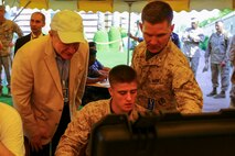 U.S. Marine Lt. Col. Todd B. Sanders, Commanding Officer Combat Logistics Battalion 22, shows U.S. Ambassador Marc J. Sievers through the evacuation control center during a bilateral non-combatant evacuation exercise at the U.S. Embassy, Muscat, Oman, Sept. 21, 2016. The non-combatant evacuation exercise is an opportunity for the United States and Oman to practice a bilateral mission of quickly providing security and safety to U.S. and international citizens abroad during a natural disaster or contingency.