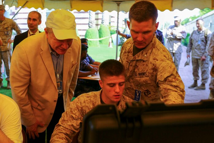 U.S. Marine Lt. Col. Todd B. Sanders, Commanding Officer Combat Logistics Battalion 22, shows U.S. Ambassador Marc J. Sievers through the evacuation control center during a bilateral non-combatant evacuation exercise at the U.S. Embassy, Muscat, Oman, Sept. 21, 2016. The non-combatant evacuation exercise is an opportunity for the United States and Oman to practice a bilateral mission of quickly providing security and safety to U.S. and international citizens abroad during a natural disaster or contingency.