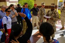 U.S. Marine Lance Cpl. Favio Cuero with the 22nd Marine Expeditionary Unit escorts U.S. and international citizens during a bilateral non-combatant evacuation exercise at the U.S. Embassy, Muscat, Oman, Sept. 21, 2016. The non-combatant evacuation exercise is an opportunity for the United States and Oman to practice a bilateral mission of quickly providing security and safety to U.S. and international citizens abroad during a natural disaster or contingency.
