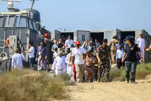 U.S. and international citizens, and members of the Royal Omani Police debark a U.S. Navy Landing Craft Air Cushioned (LCAC) with Assault Craft Unit 4 during a bilateral non-combatant evacuation exercise at the U.S. Embassy, Muscat, Oman, Sept. 21, 2016. The non-combatant evacuation exercise is an opportunity for the United States and Oman to practice a bilateral mission of quickly providing security and safety to U.S. and international citizens abroad during a natural disaster or contingency.