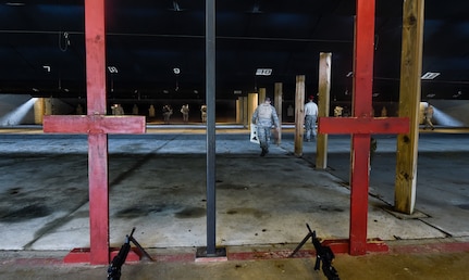 Airmen prepare their targets prior to firing the M4 rifle here, Sept. 13, 2016. Airmen fired weapons as part of an M4 rifle qualification course in preparation for a deployment, permanent change of station move or as part of annual training.