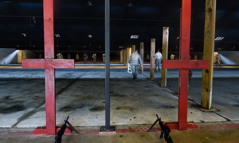 Airmen prepare their targets prior to firing the M4 rifle here, Sept. 13, 2016. Airmen fired weapons as part of an M4 rifle qualification course in preparation for a deployment, permanent change of station move or as part of annual training.