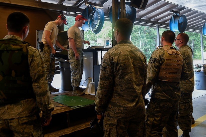 628th Security Forces Squadron combat arms training and maintenance instructors give Airmen a safety brief prior to firing M4 rifles here, Sept. 13, 2016. Airmen fired weapons as part of an M4 rifle qualification course in preparation for a deployment, permanent change of station move or as part of annual training.