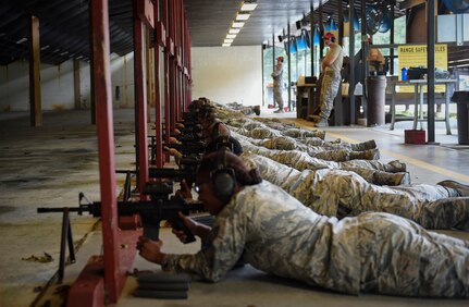 Airmen fire the M4 rifle at the firing range here, Sept. 13, 2016. Airmen fired weapons as part of an M4 rifle qualification course in preparation for a deployment, permanent change of station move or as part of annual training.
