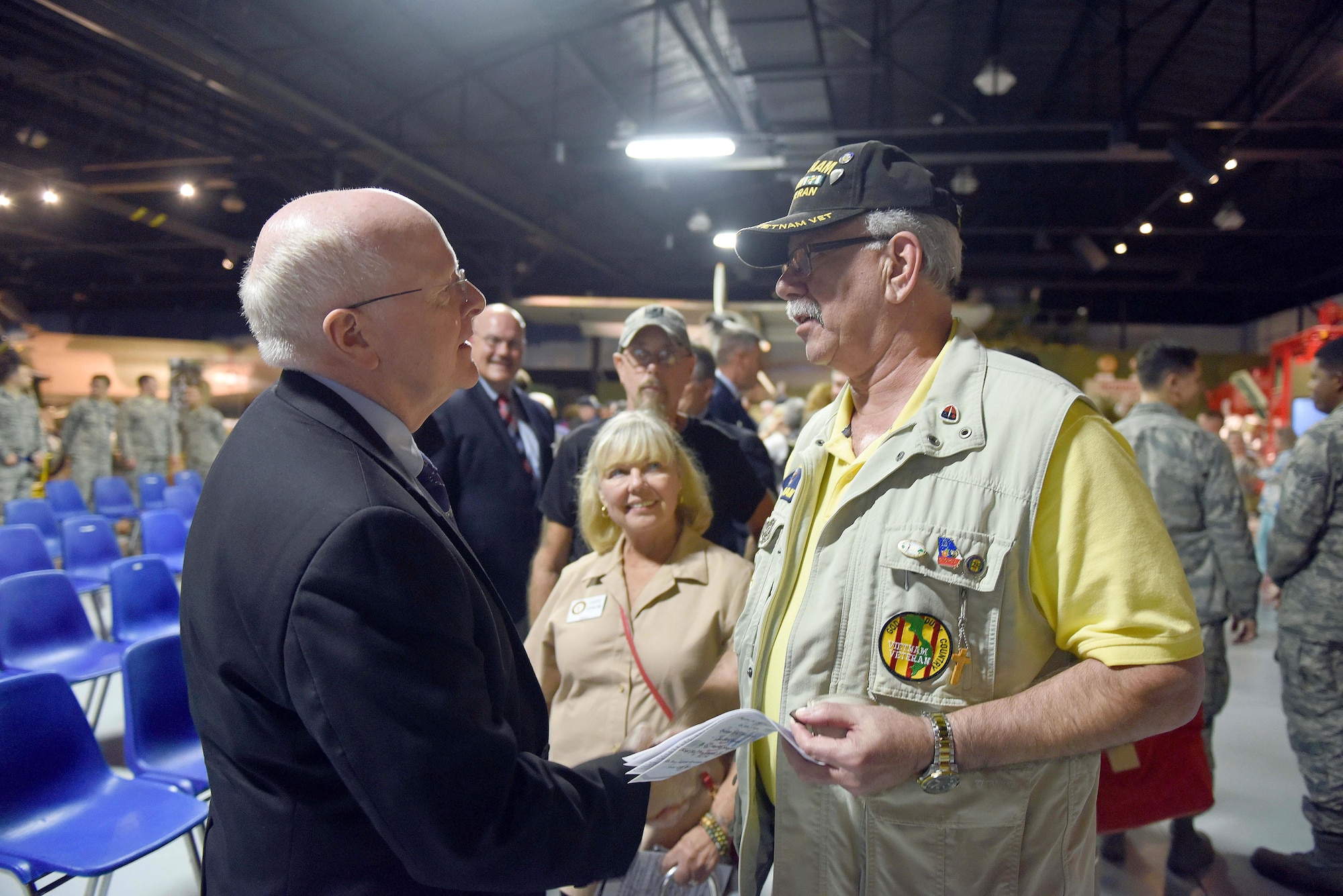 Bob Bovitch, Vietnam veteran greets POW/MIA Ceremony guest speaker, retired Chaplain (Col.) Robert G. Certain, (left), a B-52 navigator who flew 100 missions over Southeast Asia from 1971 to 1972. (U.S. Air Force photo by Tommie Horton)