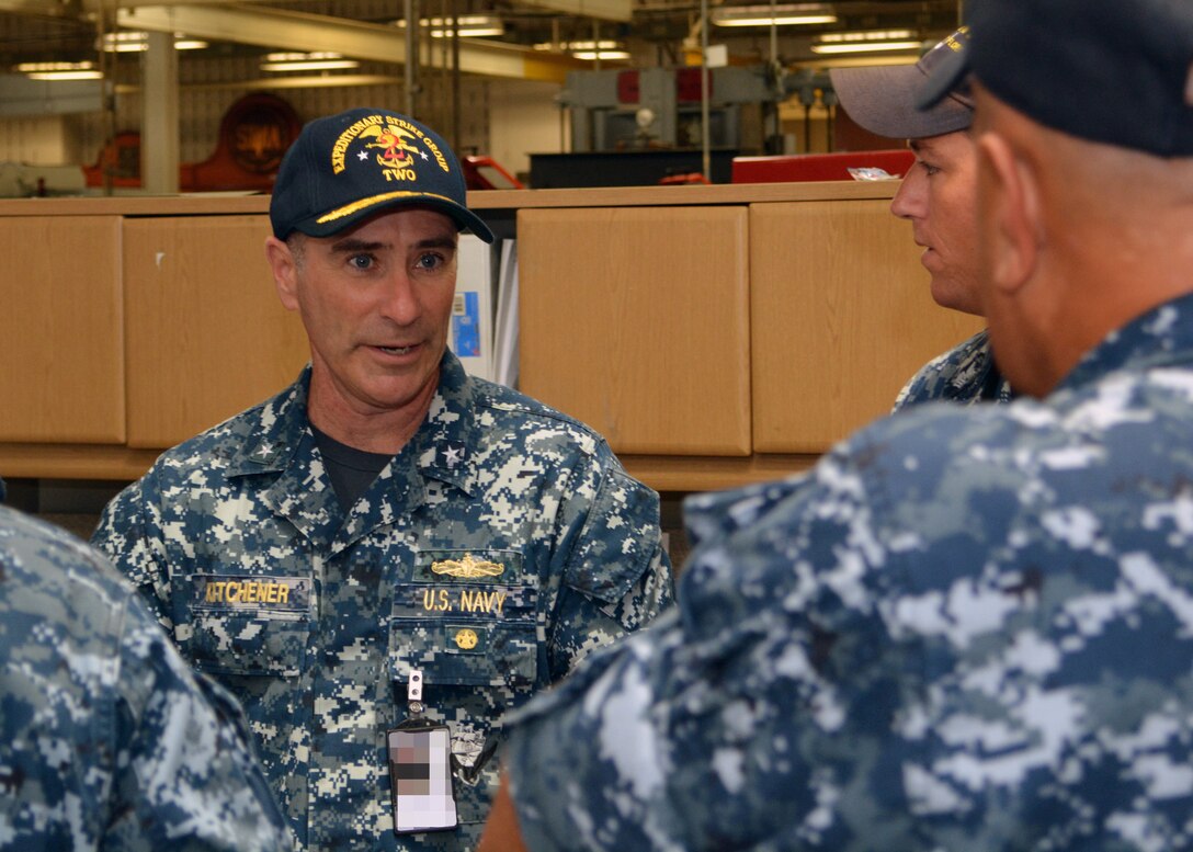 Rear Adm. Roy Kitchener, Commander, Expeditionary Strike Group 2, interacts with Sailors attached to Southeast Regional Maintenance Center's (SERMC) Pump Shop on Tuesday. Expeditionary Strike Group 2 was established in2006 as an integrated Navy and Marine Corps Staff  and is responsible for the Iwo Jima Amphibious Ready Group (IWOARG) which consists of USS Iwo  Jima (LHD 7), USS New York (LPD-21) and USS Fort McHenry (LSD 43). 