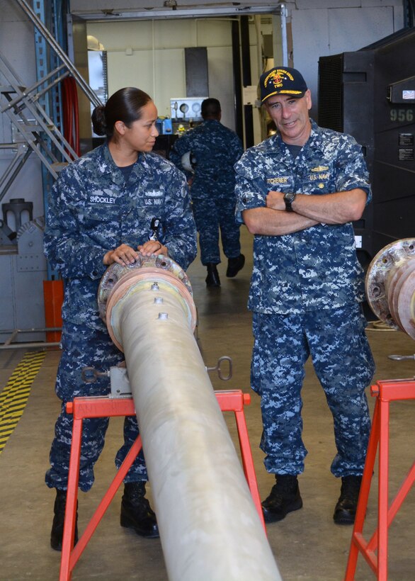 Gas Turbine Systems Technician-Electrical 1st Class Priscilla Shockley explains to Rear Adm. Roy Kitchener, Commander, Expeditionary Strike Group 2, how the Antenna Repair Shop maintain and repair whip antennas at Southeast Regional Maintenance Center (SERMC) on Tuesday. The antenna shop at SERMC repair, overhaul, preserve and test more than 20 types of shipboard antennas, antenna couplers and amplifiers. 