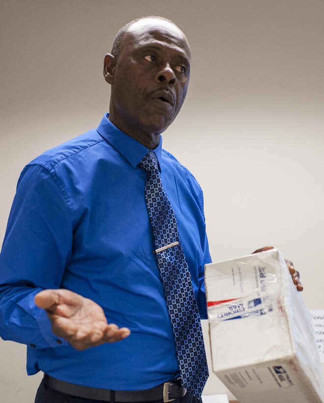 Anthony Perry, a Postal & Official Mail Management Analyst with the U.S. Army Reserve Command Services & Support Division, reviews mail-handling procedures during a Mission Readiness Exercise, Sept. 21, 2016 at Fort Bragg, N.C. The 14th Human Resources Sustainment Center, also at Fort Bragg, will be deploying to the U.S. Army Central Command theater. (U.S. Army photo by Timothy L. Hale)(Released)