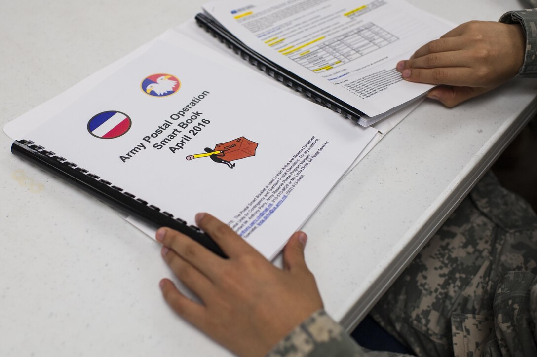 A Soldier with the 14th Human Resources Sustainment Center at Fort Bragg, N.C., reviews training material during a Mission Readiness Exercise, Sept. 21, 2016, for their upcoming deployment to the U.S. Army Central Command theater. Anthony Perry, a Postal & Official Mail Management Analyst with the U.S. Army Reserve Command Services & Support Division, conducted the training event. (U.S. Army photo by Timothy L. Hale)(Released)