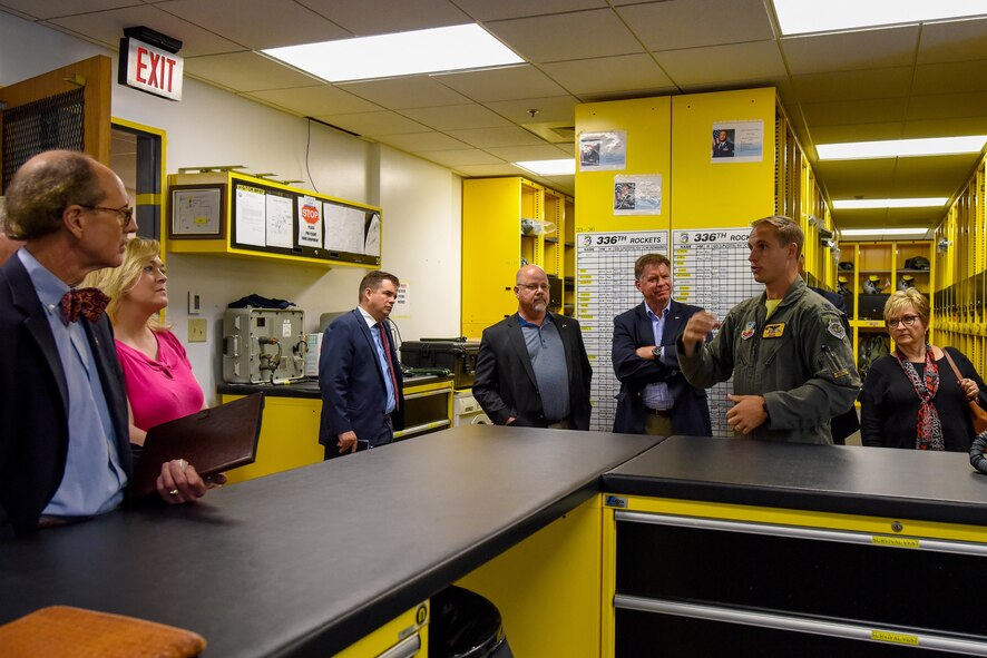 Lt. Col. Lucas Teel (right), 336th Fighter Squadron commander, speaks to members of the Joint Land Use Study Razor Talon, Sept. 16, 2016, at Seymour Johnson Air Force Base, North Carolina. Members received a briefing of Razor Talon, which is a monthly large-force training exercise for joint East Coast tactical and support aviation units. (U.S. Air Force photo by Airman Shawna L. Keyes)