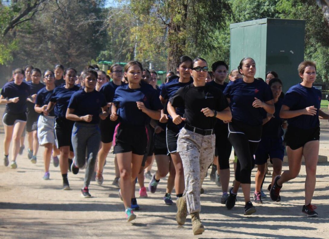 Recruiting Station Los Angeles’ Commanding Officer Maj. Aixa R. Dones, leads future Marines on a motivational run during the quarterly future Marine function at the Sherman Oaks Park in Van Nuys, Calif., Sept. 10, 2016. (U.S. Marine Corps photo by Staff Sgt. Alicia R. Leaders/Released) 