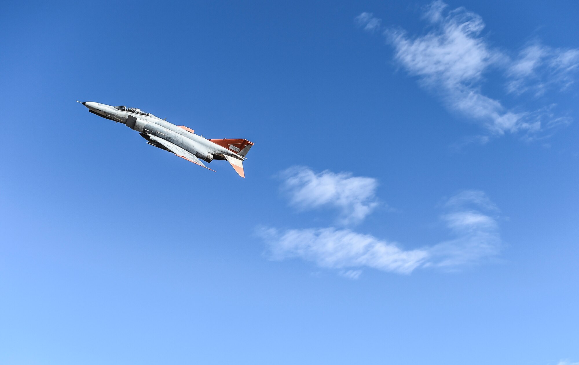 A QF-4 Phantom II departs Holloman Air Force Base, N.M. on Sept. 13, 2016 in front of 160 spectators participating in Holloman’s annual Phantom Society Tour, at Holloman AFB. The F-4 Phantom II is a twin engine, all weather, tactical fighter-bomber. It originally performed three tactical air roles: air superiority, interdiction and close-air support. The F-4 continues to serve in retirement as the QF-4 Aerial Target, an unmanned, high performance aerial target used for live air-to-air and surface-to-air missile tests. (U.S. Air Force Photo by Staff Sgt Stacy Jonsgaard)