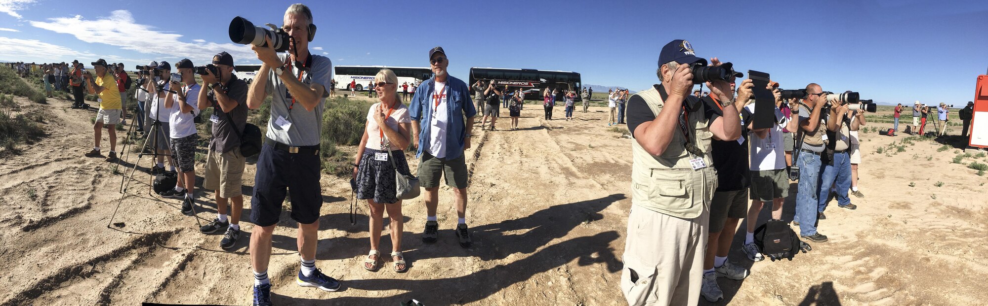 160 spectators participating in Holloman’s annual Phantom Society take pictures on Sept. 13, 2016, at Holloman AFB take picture of aircraft fly overs. The tour enabled aircraft enthusiasts, including veterans and non-veterans with aviation backgrounds, to explore various base locations. The tour included an F-16 Fighting Falcon static and briefing, travel to Holloman’s High Speed Test Track, the opportunity to view QF-4s and F-16s in flight, and a visit to Heritage Park to view statics displays of various aircraft flown at Holloman AFB. (U.S Air Force Photo by Staff Sgt Stacy Jonsgaard)