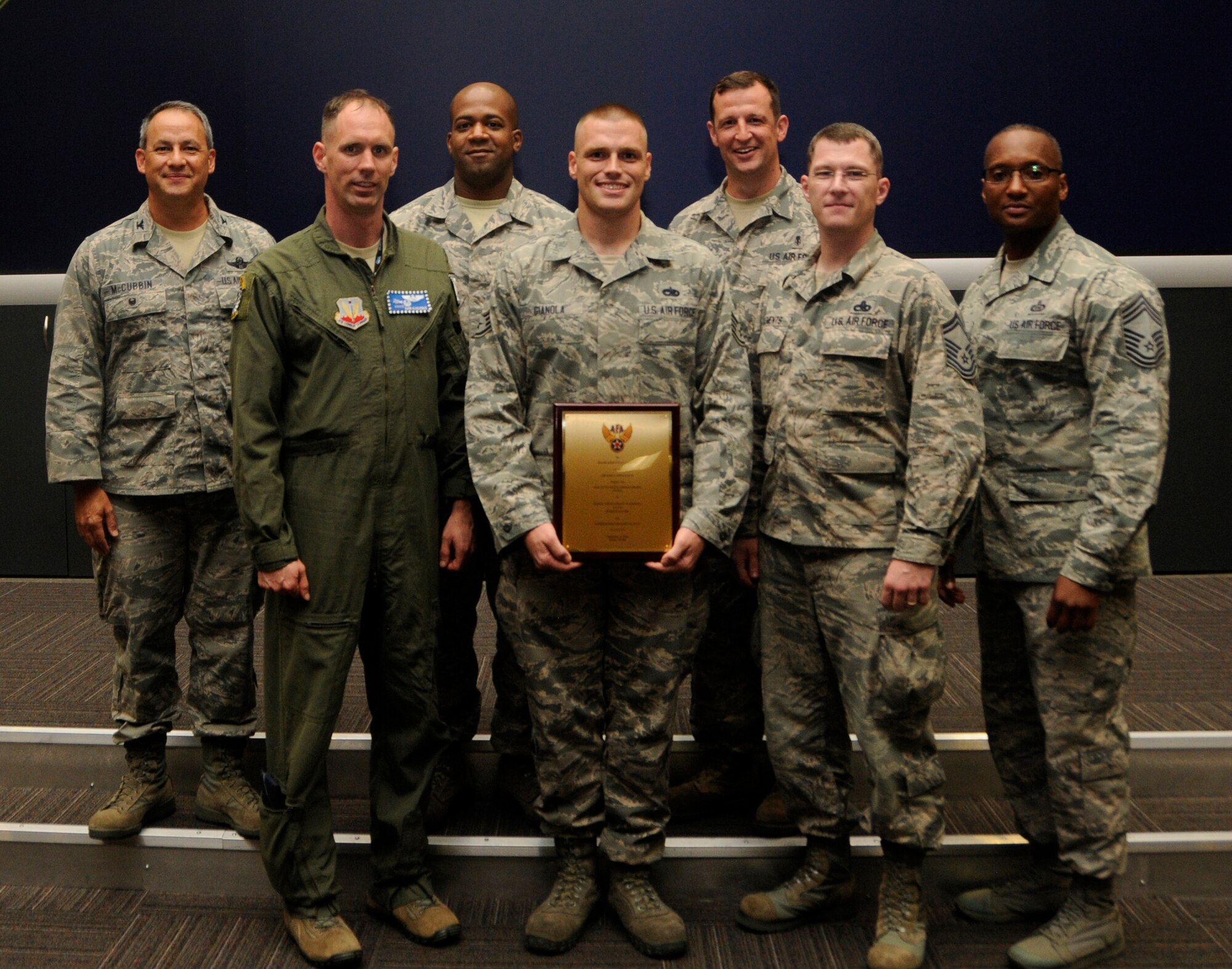 Staff Sgt. Grant Gianola, center, a 367th Fighter Squadron aerospace propulsion jet mechanic, stands with members of his leadership after being awarded the Outstanding Airman of the year award by the Air Force Association Miami-Homestead at U.S. Southern Command in Doral, Florida, Sept. 16. The AFA is an organization that works to connect servicemembers with professional development resources and other support initiatives.(U.S. Air Force photo by Senior Airman Aja Heiden)
