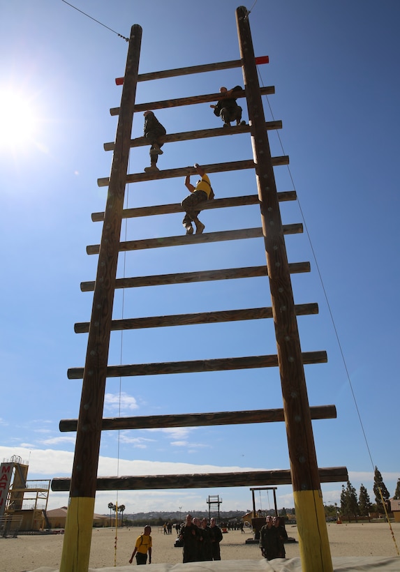 Recruits from Hotel Company, 2nd Recruit Training Battalion, climb the Stairway to Heaven obstacle on Confidence Course II at Marine Corps Recruit Depot San Diego, Sept. 13. Drill instructors supervised the exercise and advised the recruits on the technique needed to complete it. Annually, more than 17,000 males recruited from the Western Recruiting Region are trained at MCRD San Diego. Hotel Company is scheduled to graduate Nov. 9.