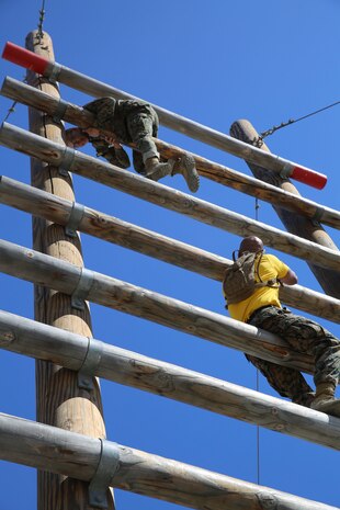 A recruit from Hotel Company, 2nd Recruit Training Battalion, maneuvers over a log the Stairway to Heaven obstacle during Confidence Course II at Marine Corps Recruit Depot San Diego, Sept. 13.The stairway to heaven is a 30-foot ladder-like obstacle that recruits climb to the top, maintain a low profile while crossing over and then climb back down. Annually, more than 17,000 males recruited from the Western Recruiting Region are trained at MCRD San Diego. Hotel Company is scheduled to graduate Nov. 9.