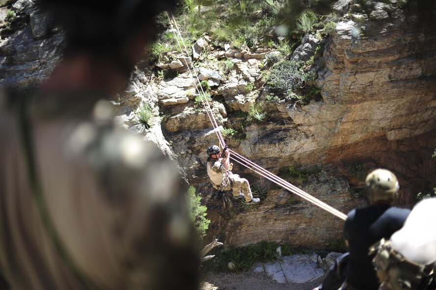 A pararescueman from the 48th Rescue Squadron traverses a ravine on a highline at the Coronado National Forest in Tucson, Ariz., Sept. 16, 2016. The 48th RQS deploys Guardian Angel forces worldwide in support of national security objectives and homeland defense. (U.S. Air Force photo by Airman Nathan H. Barbour)