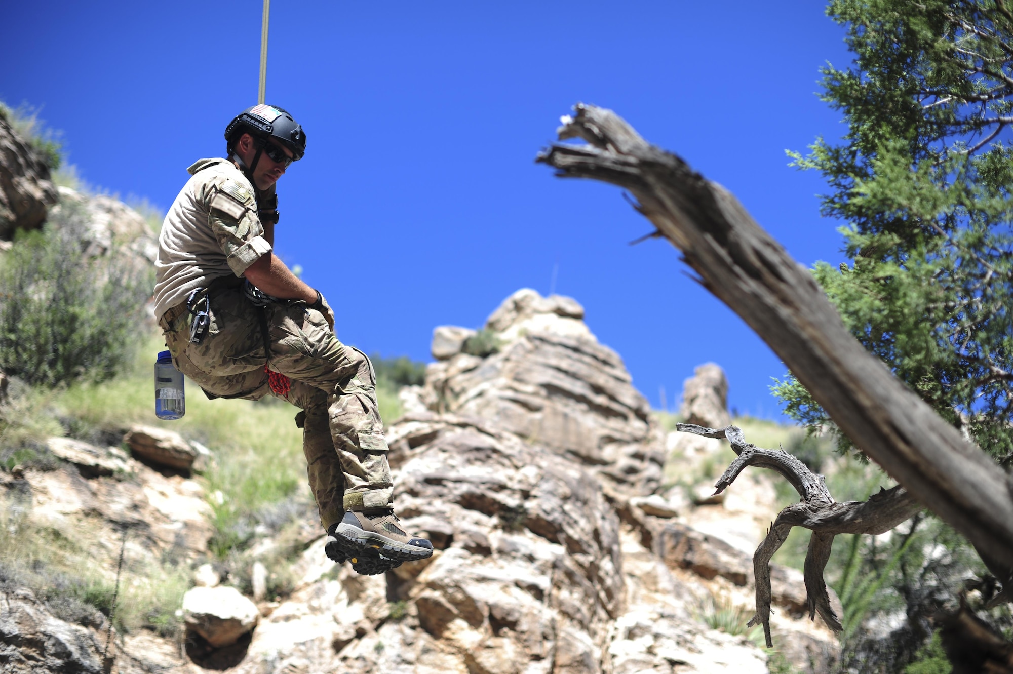 A pararescueman from the 48th Rescue Squadron descends into a ravine from a highline at the Coronado National Forest in Tucson, Ariz., Sept. 16, 2016. The 48th RQS provides highly trained experts capable of executing personnel recovery operations across the spectrum of conflict. (U.S. Air Force photo by Airman Nathan H. Barbour)
